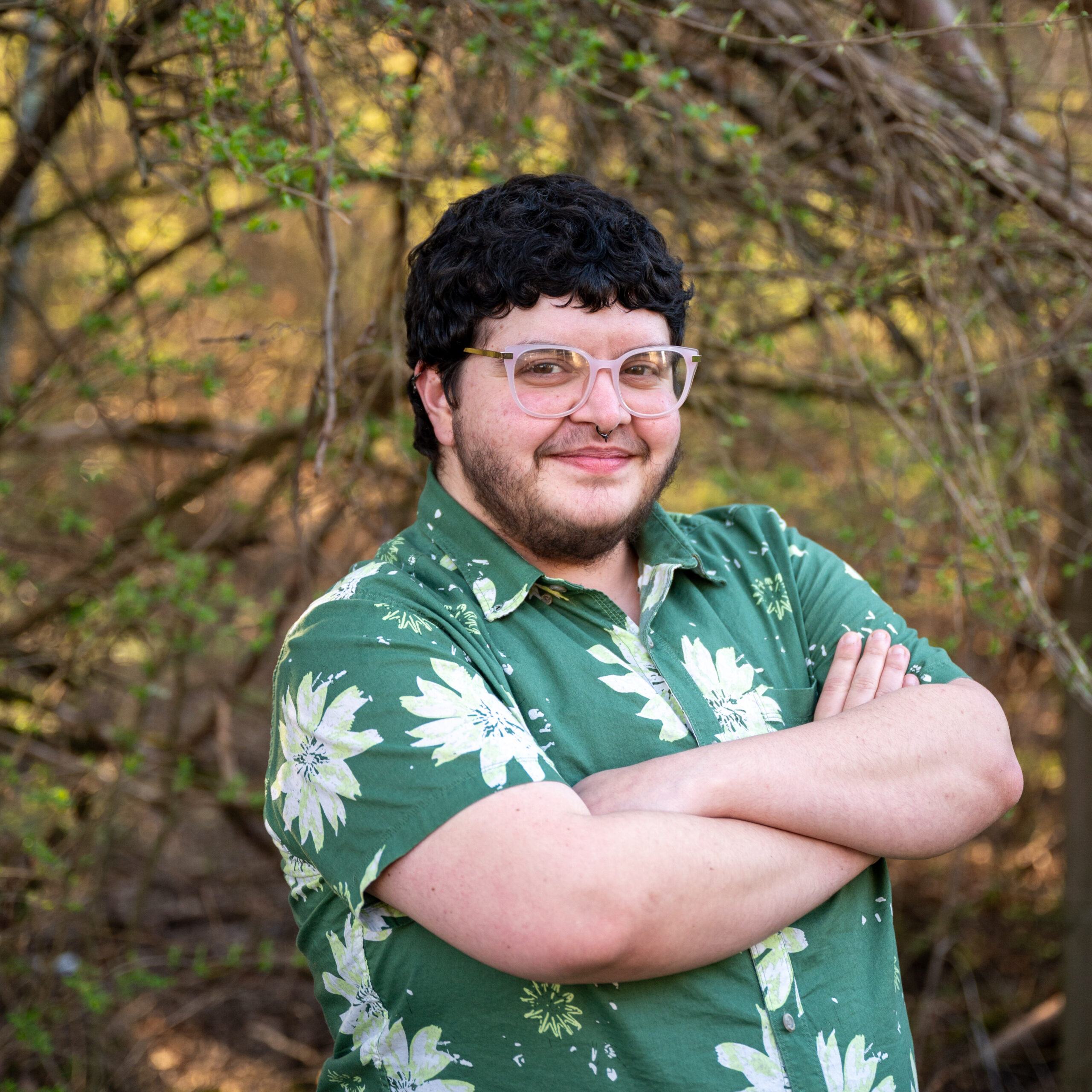 Jaq Payne, National Champion Tree Program Director, standing in front of a tree